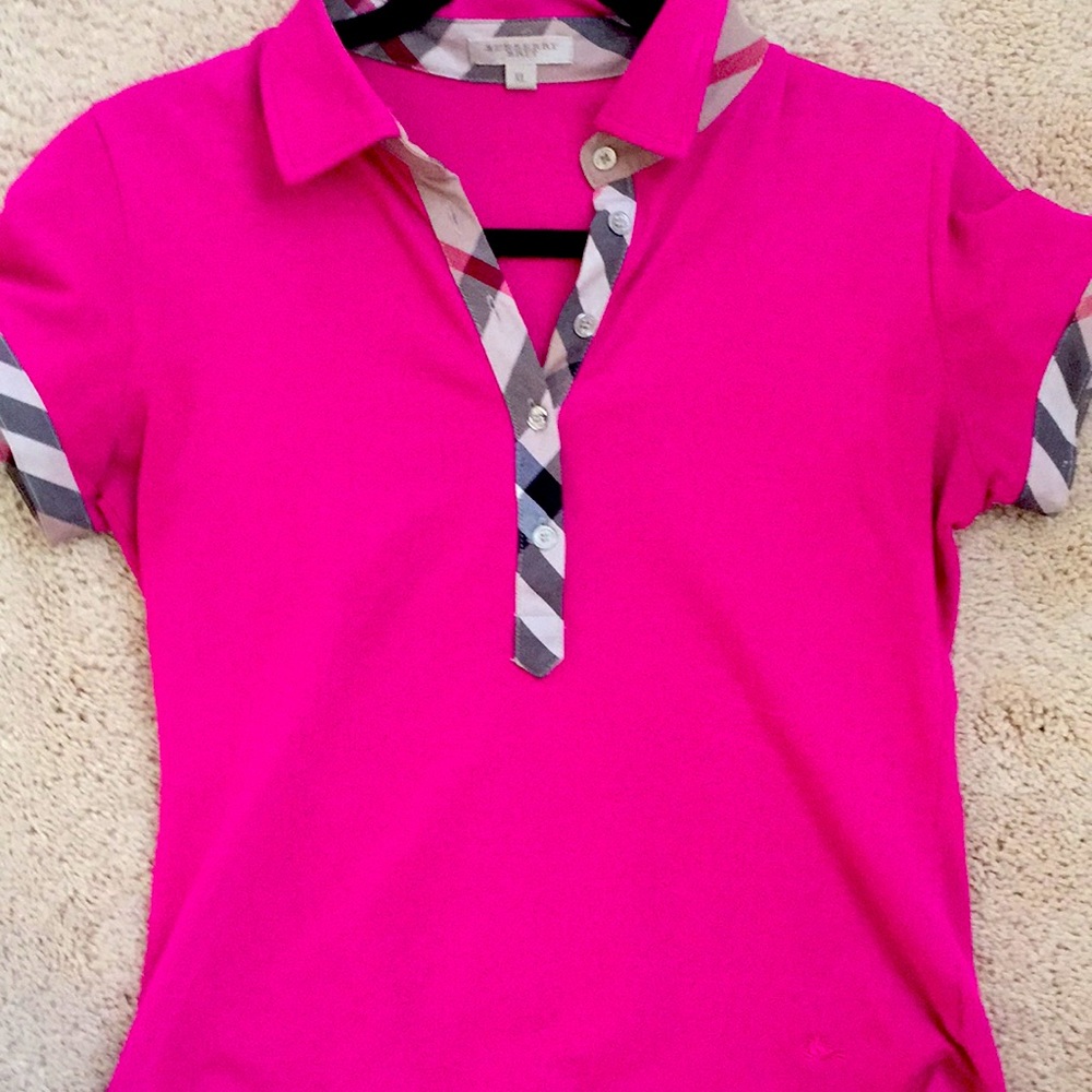 A pink women’s polo